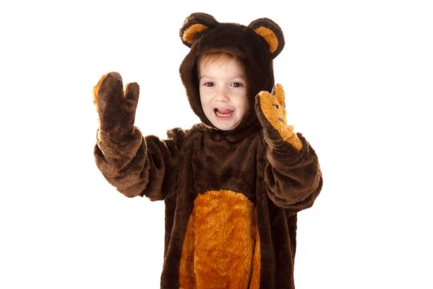 istock Child in a christmas carnival bear costume isolated on white with copy space,  joy. 1160924732