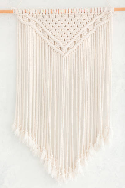 istock Close up of cotton macrame panel fringe in a minimalistic scandinavian wall. Texture. Background. 1160926409