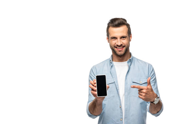 istock smiling man pointing with finger at smartphone with blank screen Isolated On White 1160926575