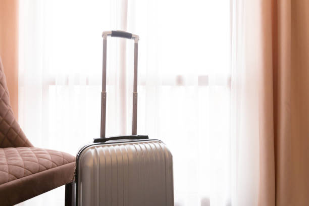 istock Suitcase or luggage bag in a modern hotel room 1160927491
