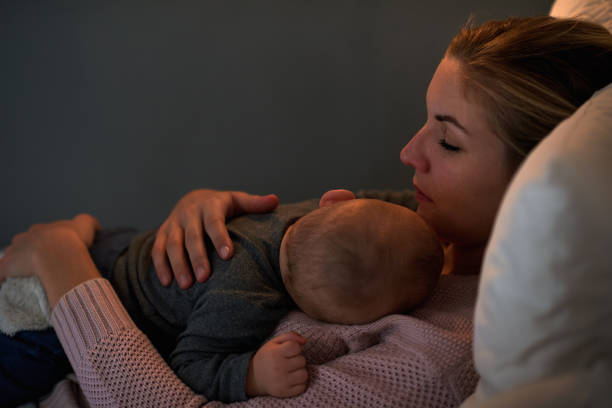 istock Mother hugging her sleeping child 1160927923