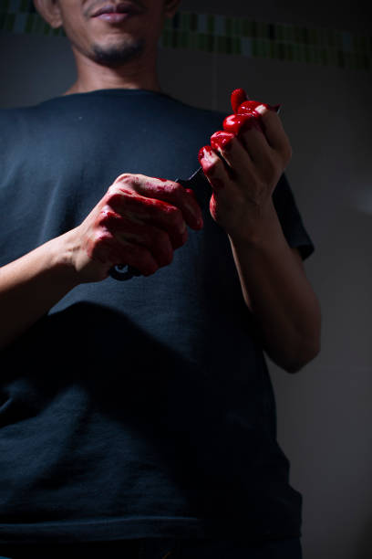 Psychotic murderer and a knife in his bloody hands