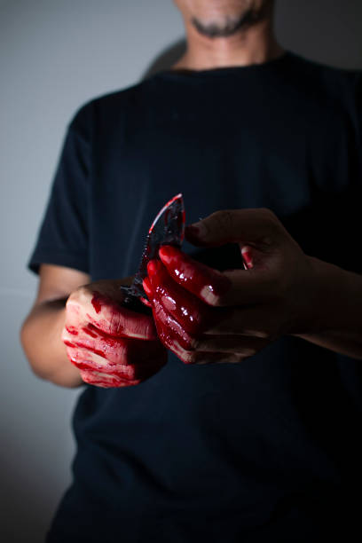 Psychotic murderer and a knife in his bloody hands