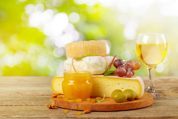 istock Tasty beautiful cheese composition on wooden board 1160929041