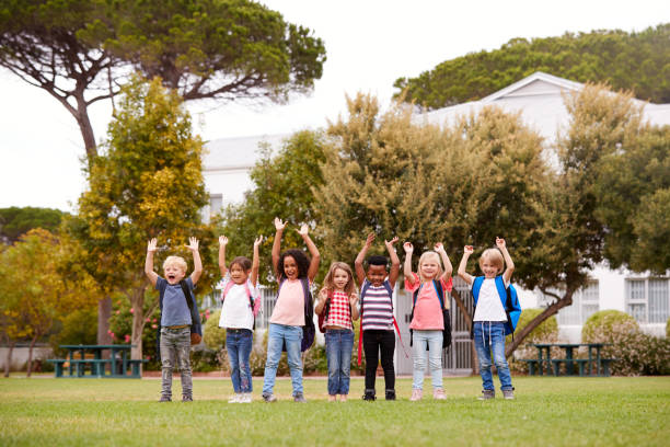 istock Excited Elementary School Pupils On Playing Field At Break Time 1160932302