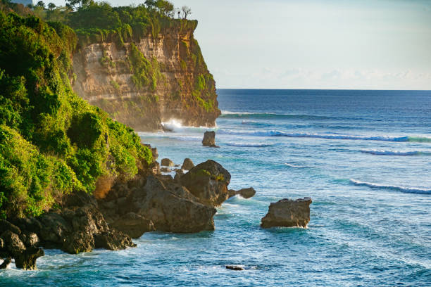 istock Bali, rocky cliffs and ocean. Sunset in Uluwatu 1160932852