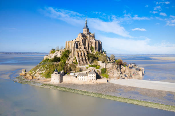 The famous of top view with blue sky at Mont-Saint-Michel, Normandy, France The famous of top view with blue sky at Mont-Saint-Michel, Normandy, France mont saint michel photos stock pictures, royalty-free photos & images