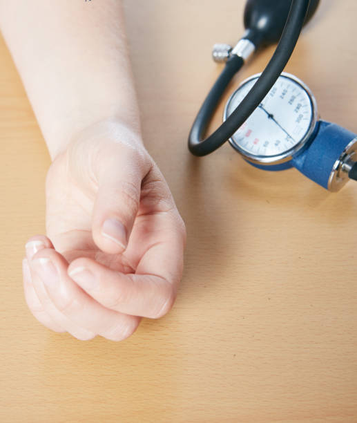 istock Blood pressure meter next to woman's arm 1160934471