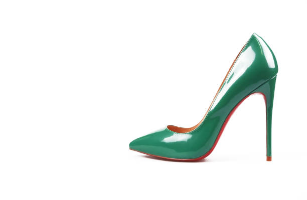 istock female green shoes on white background 1160938435
