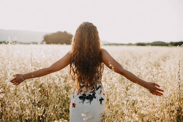 istock Girl in the field 1160939106