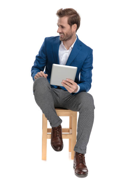 istock Positive casual guy laughing and holding his table 1160939231