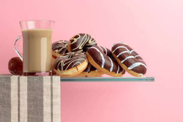 istock Chocolate donuts and latte on a black background. 1160939252