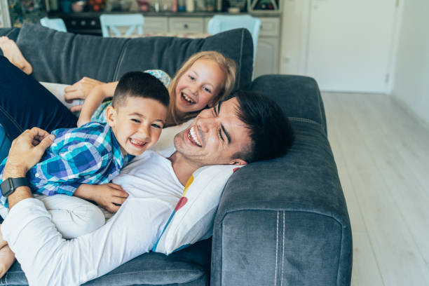 istock Father and children's time 1160940188