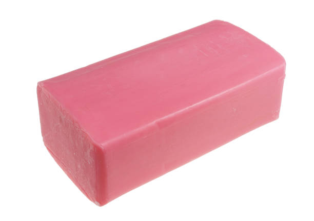 rectangular piece of new pink soap with strawberry smell as a means of combating homemade moths mole. isolated - wet strawberry macro fruit imagens e fotografias de stock