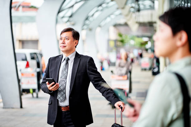 istock Confident businessman waiting outside airport 1160946020