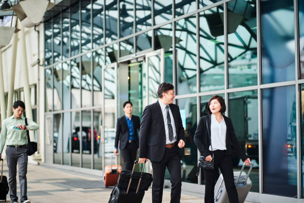istock Business professionals walking outside airport 1160946266