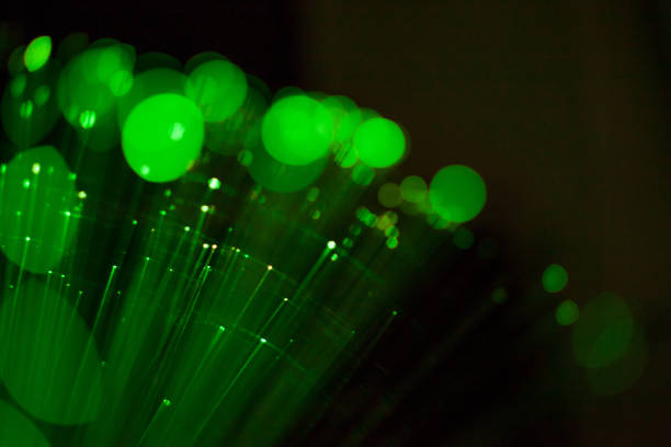 istock Fiber optic, glare in the focus. Abstract futuristic background 1160946513