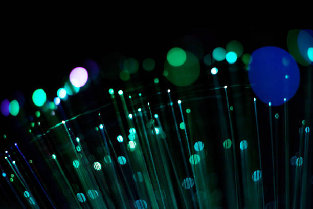 istock Fiber optic, glare in the focus. Abstract futuristic background 1160946518