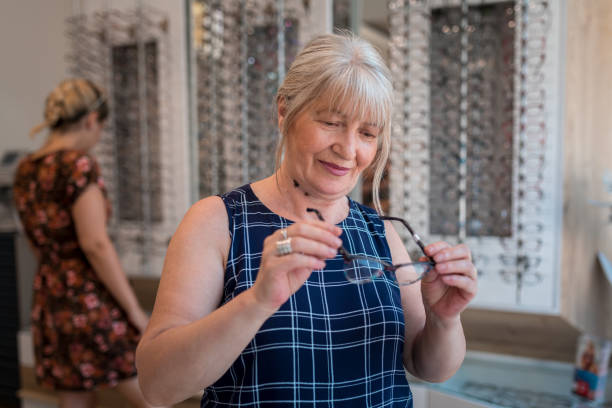 istock Senior woman choosing eyeglasses 1160947371