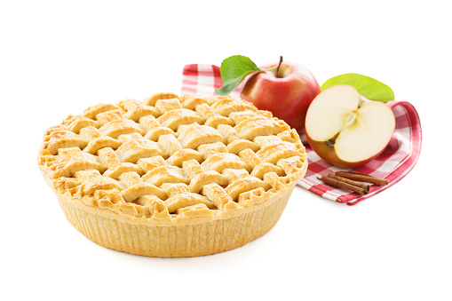 Homemade apple pie, apples and red checkered tablecloth isolated on white background.