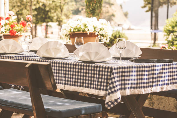 istock Serving at a European restaurant on street, menu and table. 1160948724