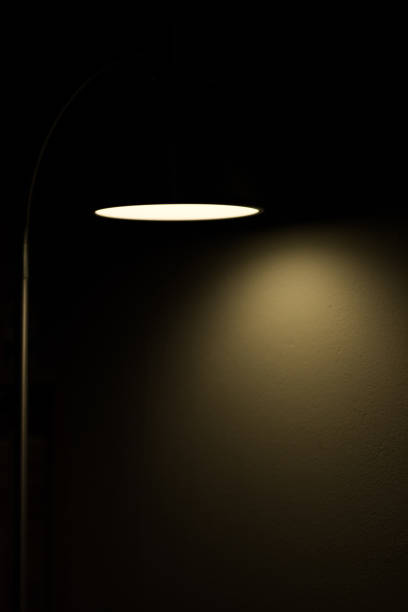 istock Dark room and circle of light minimal background 1160948738