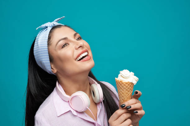 istock Young stylish brunette keeping ice cream and laughing 1160954439