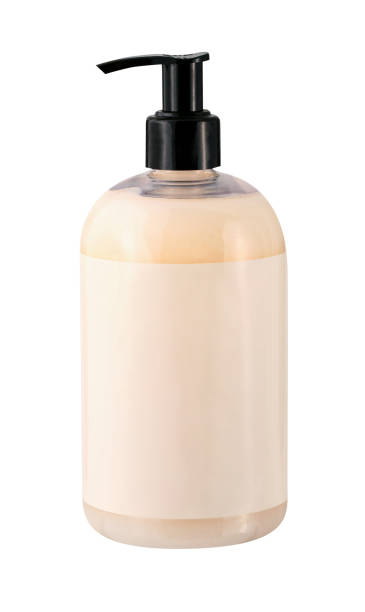 botella de bomba de color melocotón - liquid soap fotografías e imágenes de stock