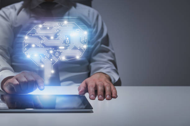 istock Businessman with tablet at table, AI concept 1160955944
