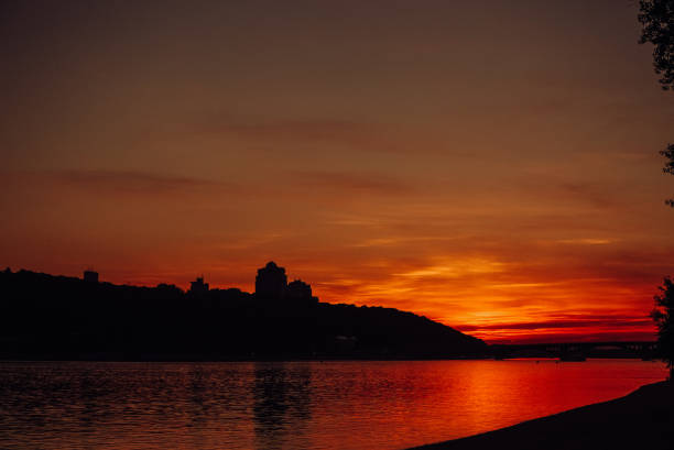 istock sunset red city river water sky 1160957980