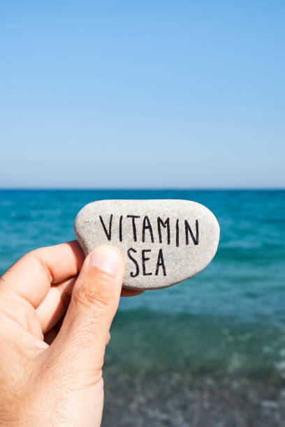 istock text vitamin sea in a stone on the beach 1160962421