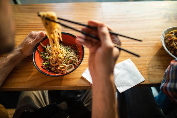 istock Enjoying  noodles with vegetables in restaurant 1160963192