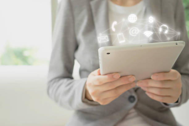 istock Businesswoman hand holding smart phone with digital technology global network 1160963557