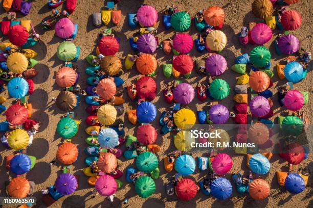 Top Aerial View Of Colorful Beach Umbrellas With People Enjoying The Summer Bali Indonesia Stock Photo - Download Image Now