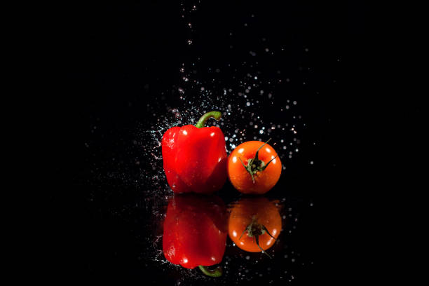 istock The paper and tomato  stand on the black background 1160963615