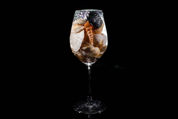 istock The glass with seashells stand on the table 1160963619