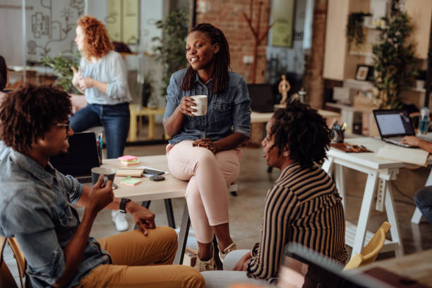 istock Multi ethnic group of creatives having chat during coffee break 1160963983