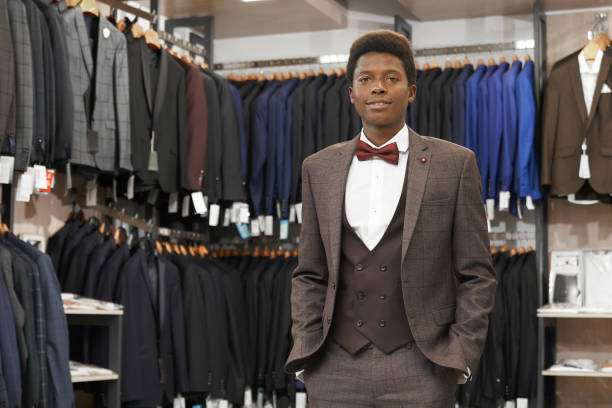 istock African man in boutique wearing in elegant suit. 1160964892