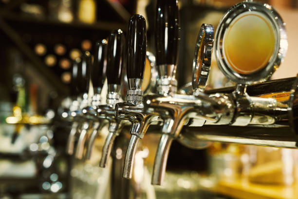 istock Row of beer taps. 1160964909