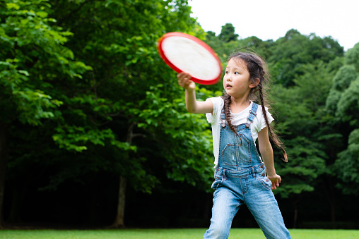 Girl playing with frisbee