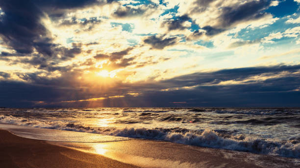 istock Beach with waves at colorful sunset 1160966625
