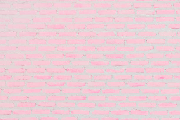 istock Pastal Pink and White brick wall texture background. Brickwork or stonework flooring interior rock old pattern clean concrete grid uneven bricks design stack. 1160967172