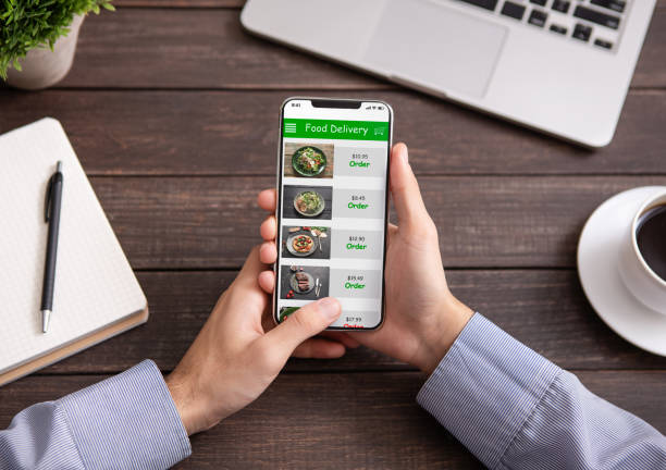 istock Hand touching phone screen for choosing food 1160967822