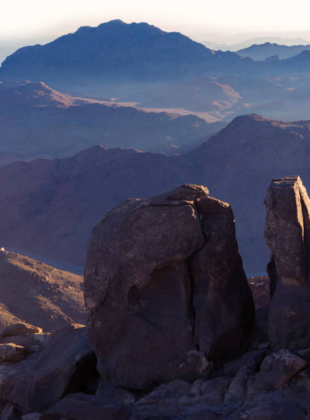 istock Beautiful view from the mountain. Panorama. Mountain range with visible silhouettes through the morning blue fog 1160969219