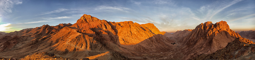 multiple close-up shots composition showing a wide natural mountain landscape in the Carnic Alps seen from above at sunset during autumn season while clouds travel in the clear sky