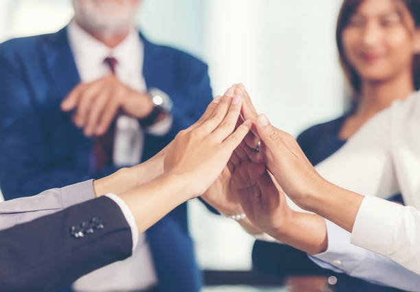 istock Business partner woman and man team joining and stack hand together 1160969729