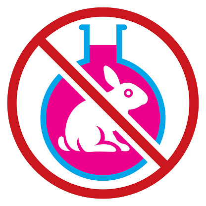 A circular no animal testing sign consisting of a line crossing in front of a rabbit inside a liquid filled flask. Isolated.