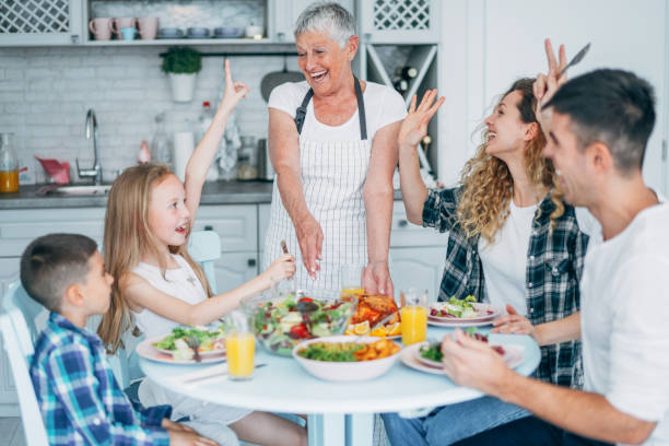 istock Cheerful family having lunch 1160970359