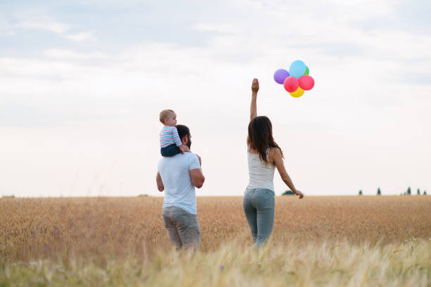 istock Daddy, mom and child having fun outdoors 1160972641