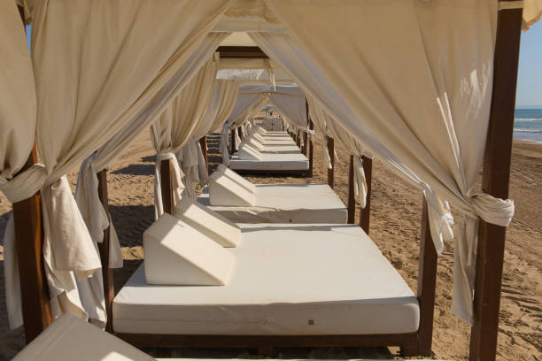istock Luxury beach bed for two people with white roof and sides panoramic view 1160974240